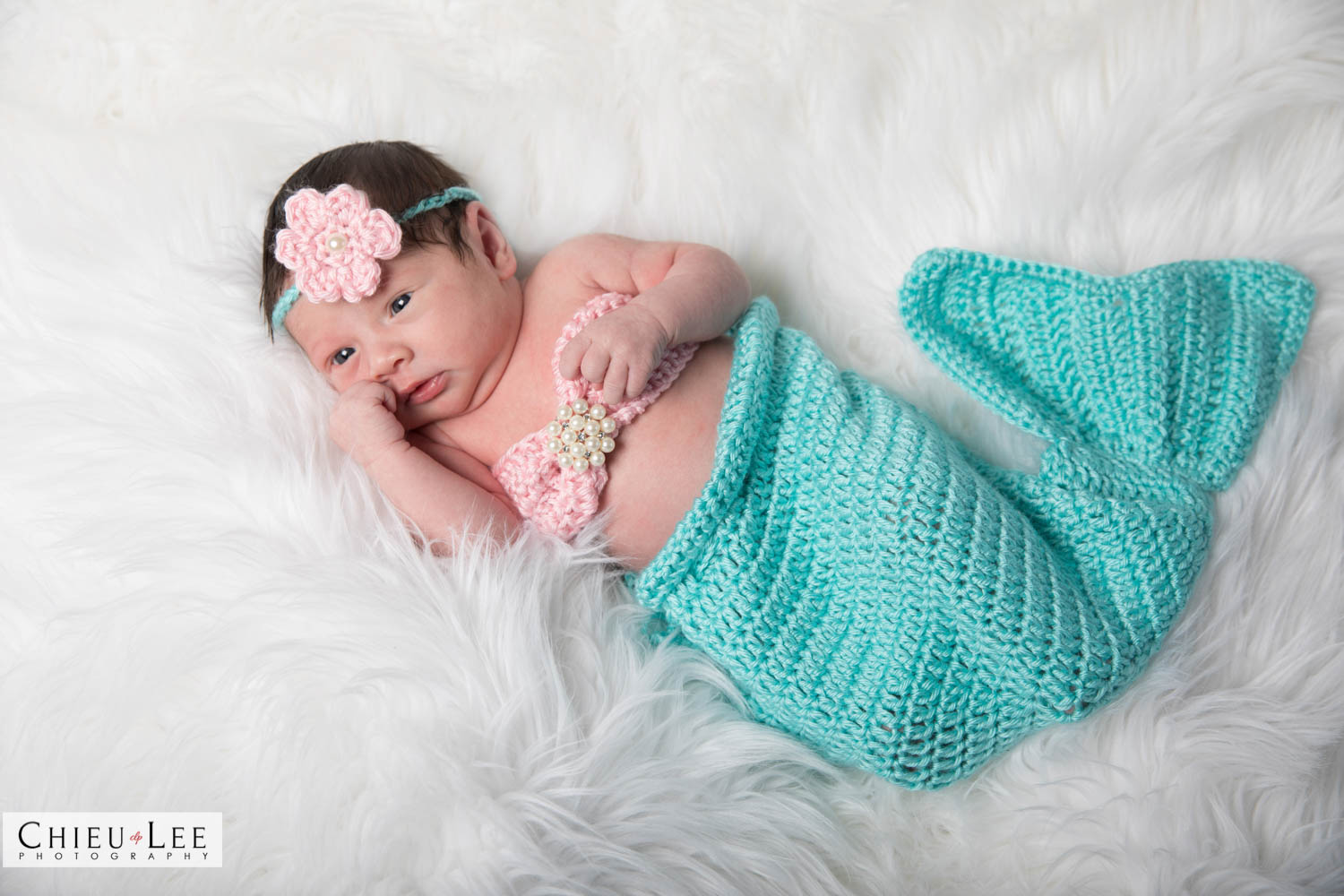 Full body newborn baby girl pink flower headband pastel colors mermaid crochet turquoise teal blue green on white fur