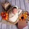 Newborn baby sleeping in a woven basket in a Chantilly, VA home