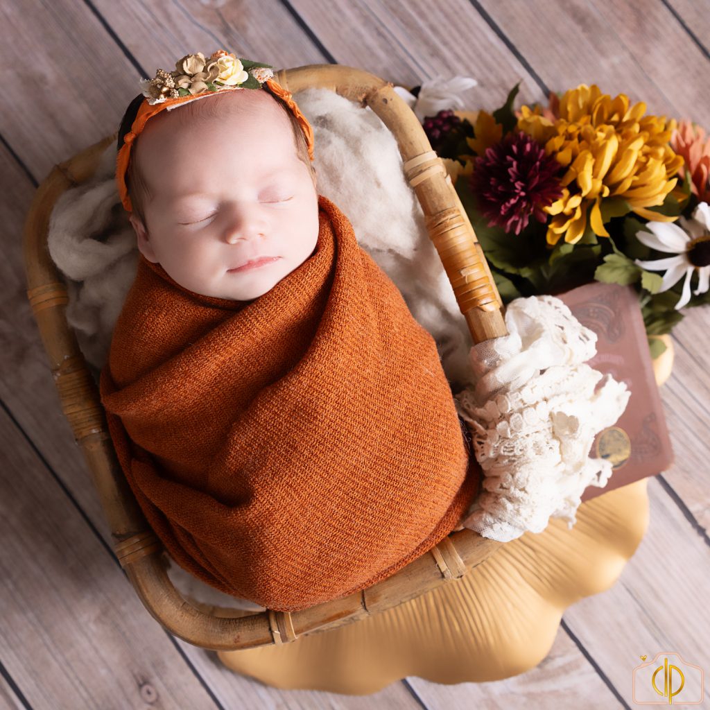 baby girl in burnt orange colors for fall